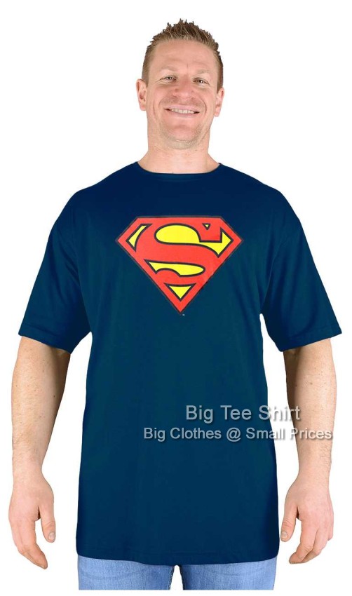A man wearing a black coloured Superman logo t shirt.