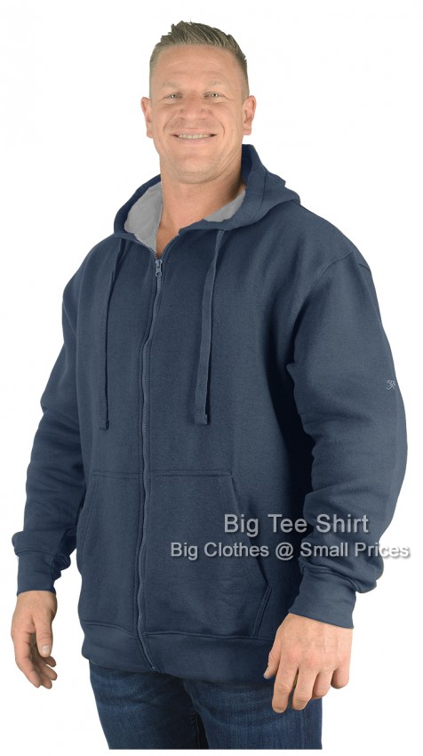 A man wearing a indigo blue zip hoodie.