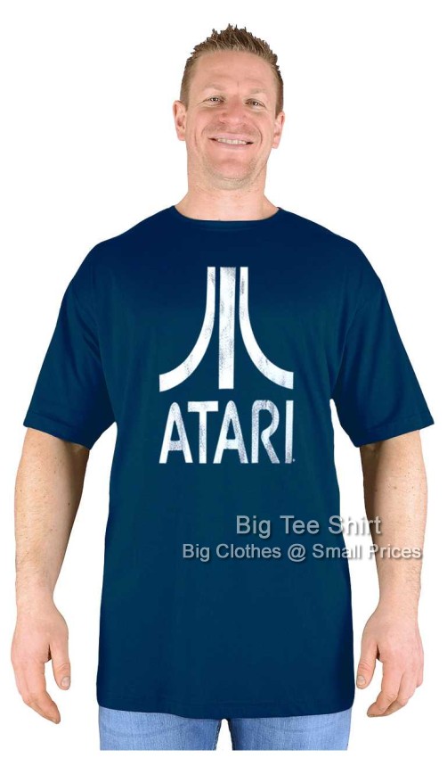 A man wearing a black t shirt with a Atari logo on it.