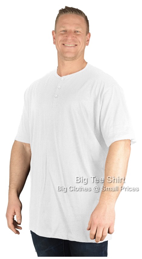 A man wearing a white grandad top